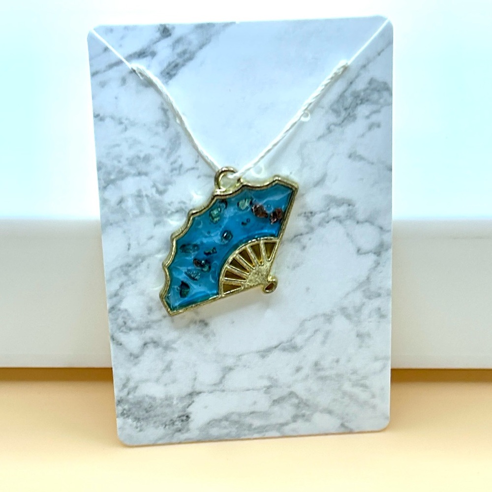 Fan shape charm gem